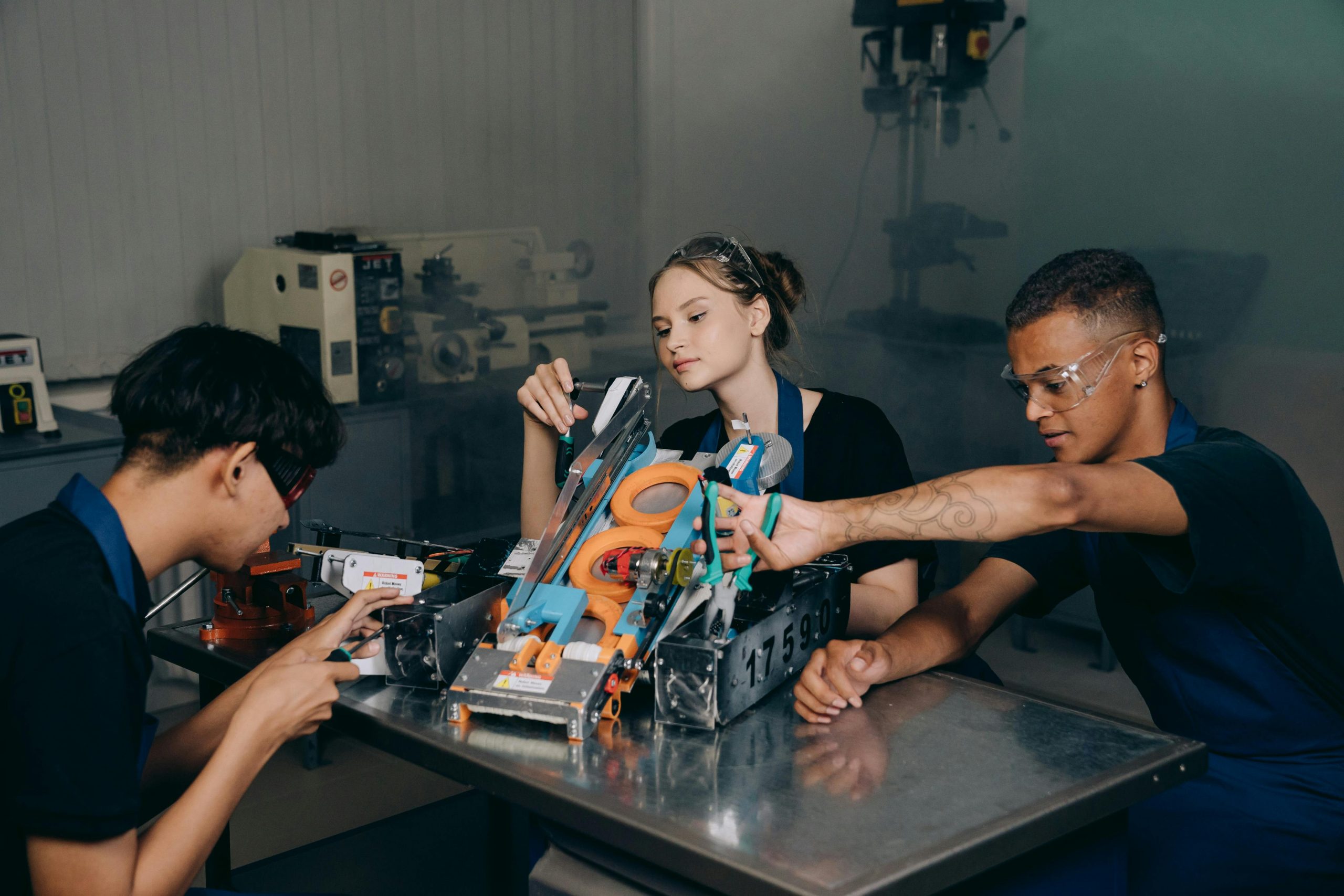 people working on a machine